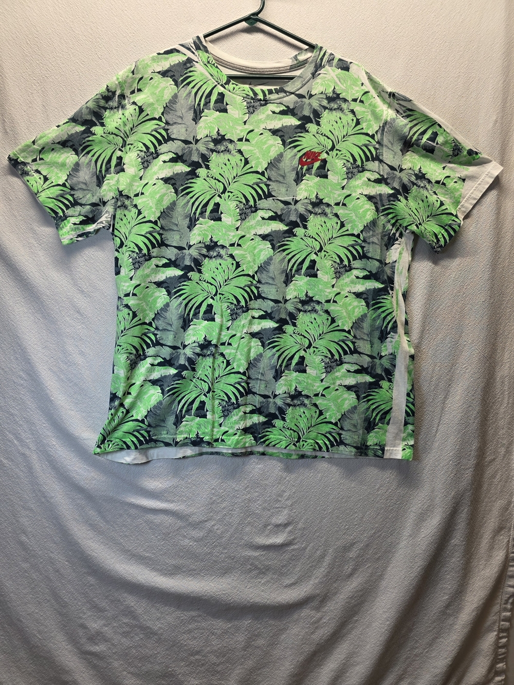 Nike Tropical Leaf-Print Short-Sleeve T-Shirt With A Small Red Nike Logo